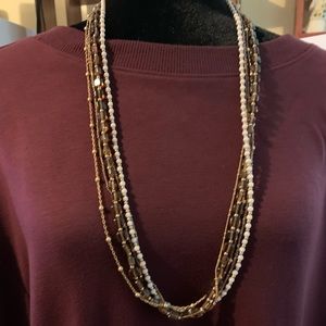 Brown and gold colored necklace